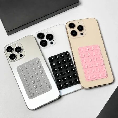 iPhone bubble pop fidget silicone case in gray, black and pink with raised sensory bubbles